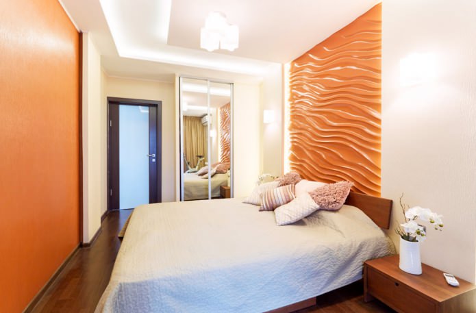 оранжевые 3Д-панели на стене в спальне